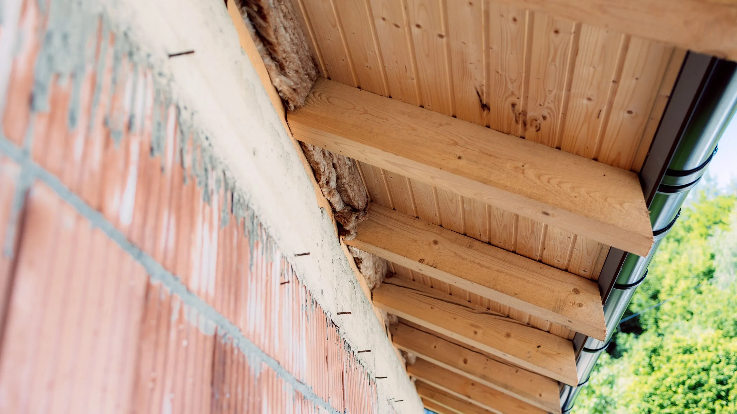 Location of soffit and fascia on a home roofline overhang with labeled components